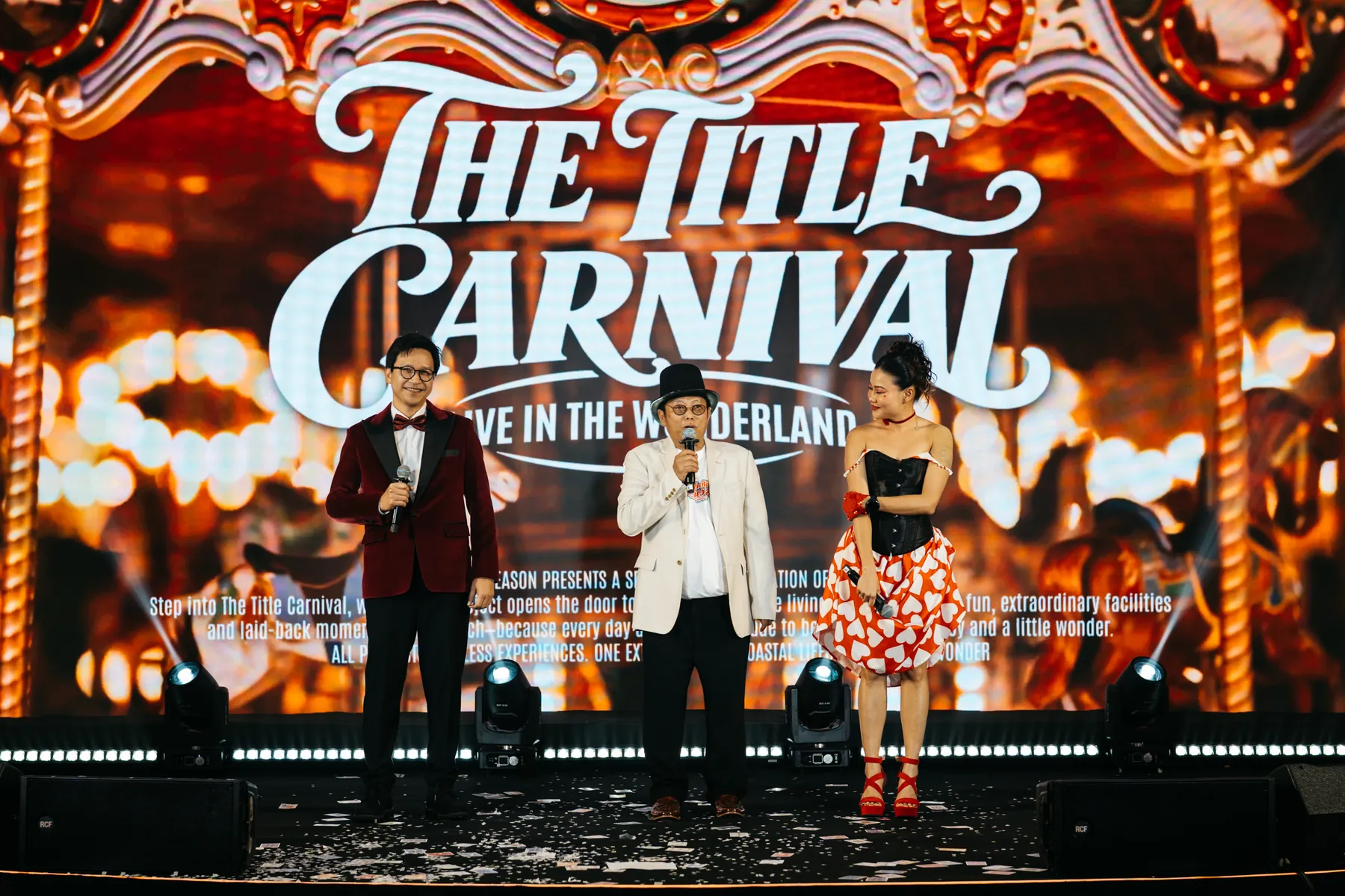 The Title representatives speaking on stage at The Title Carnival